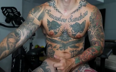 Heavily Tattooed Guy Cums on His Thigh