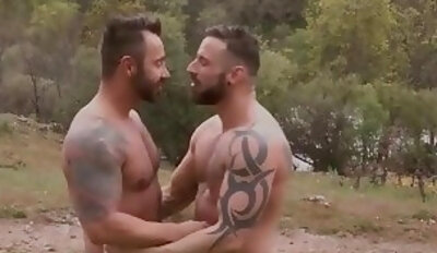 Inked hunks having anal fun on a hitchhiking trip in nature